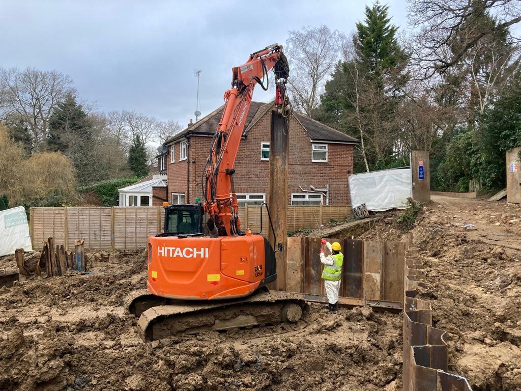 Sheet piling installed in preparation for basement excavation.