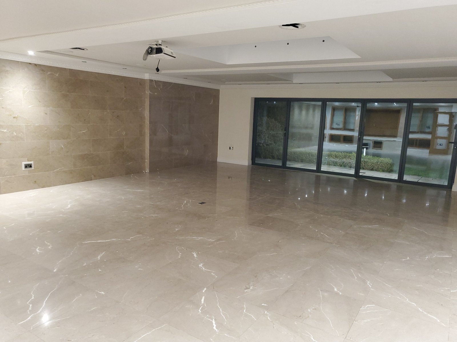 Newly built dining room with marble flooring.