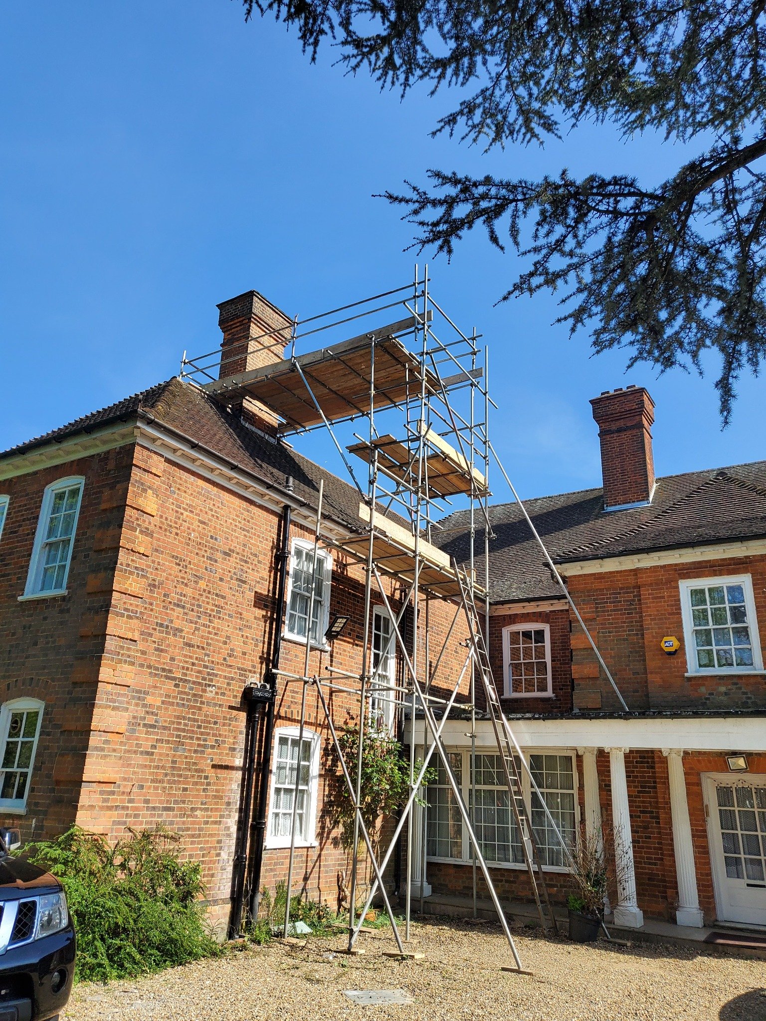 Existing chimney masonry repointed to improve condition and weather resistance.